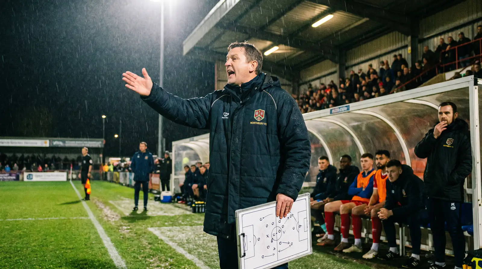 Manager making tactical substitution at half-time to increase attacking output